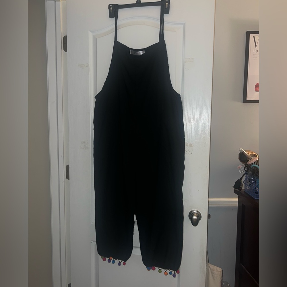 Black jumpsuit with colorful polka dot detailing
